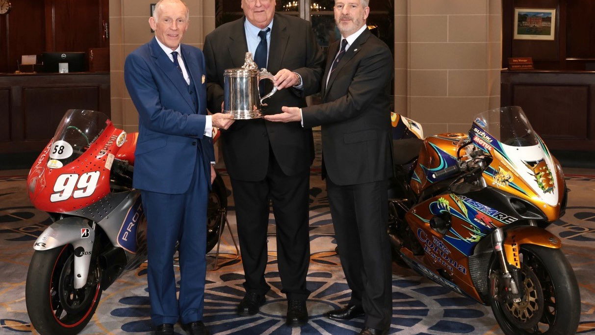 Ben Cussons and Barrie Baxter present Mike Trimby with the Torrens Trophy
